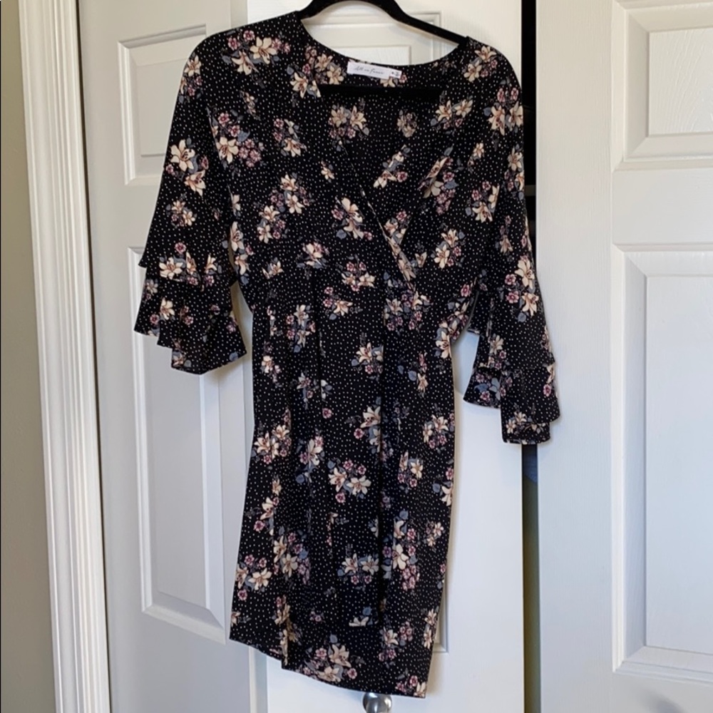 Faux wrap dress with flounce sleeves.